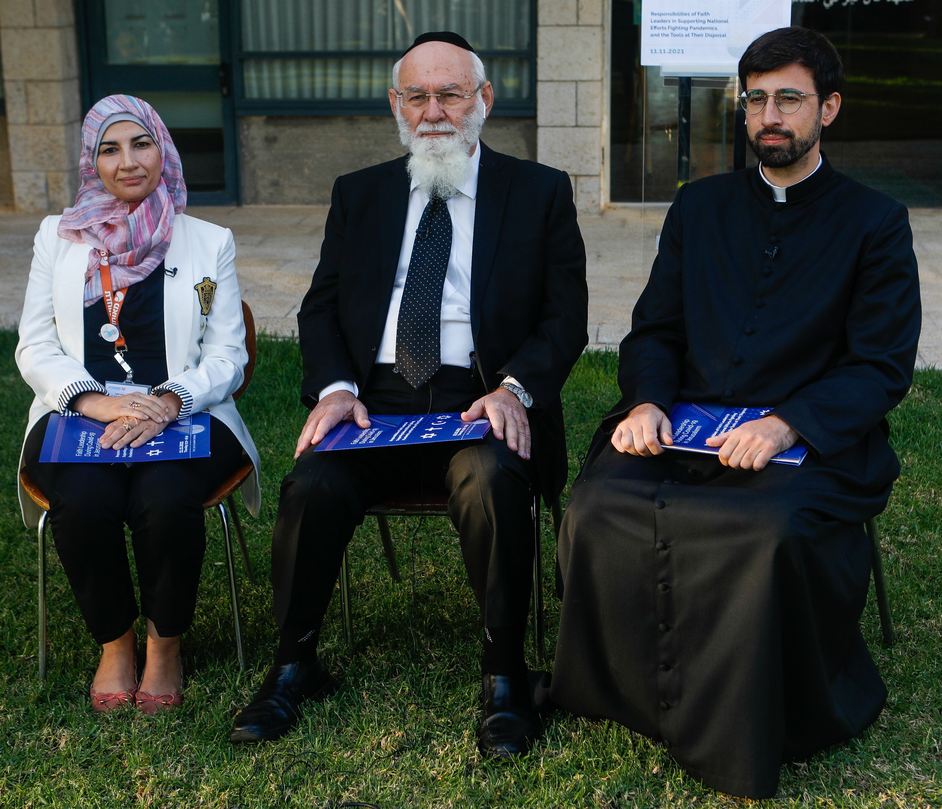 3 Religious leaders sitting on chairs